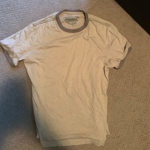 Tan plain shirt, with hints of brown.